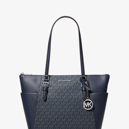 Bolso tote grande Michael Kors modelo Charlotte en color azul con cierre superior.