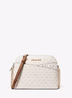 Cartera tote grande Michael Kors Jet Set Travel con monograma en tonos vainilla.